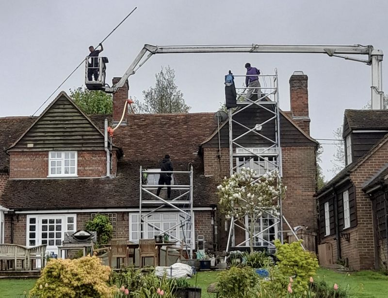 The Roof Moss Cleaners using cherry picker and scaffolding to clean roof safely and professionally in Cheshunt, Hertfordshire