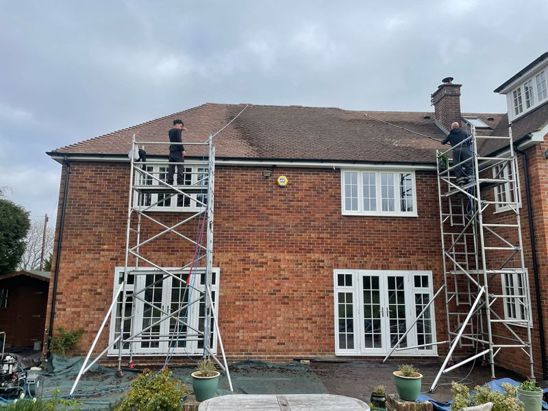 Roof cleaning carried out safely from scaffold towers by The Roof Moss Cleaners in Cheshunt